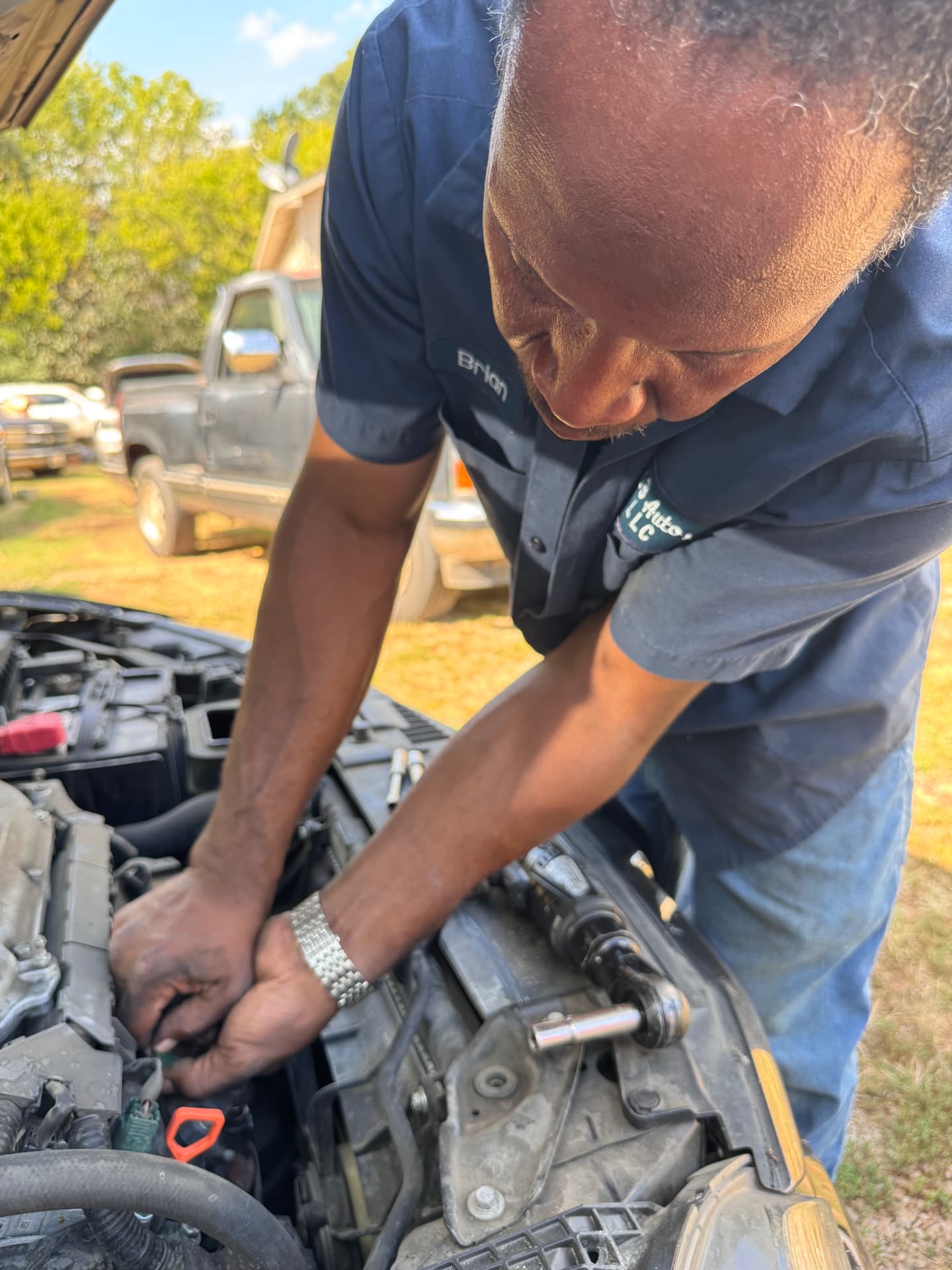 Brian of BLB Auto, LLC working in an engine bay
